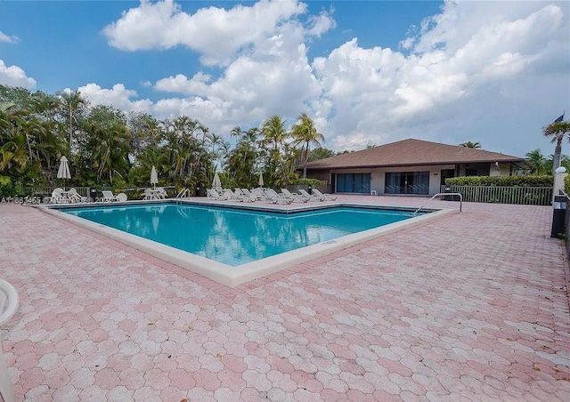 view of swimming pool featuring a patio