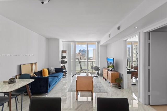 living room featuring floor to ceiling windows