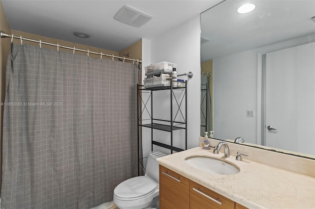 full bath featuring toilet, a shower with shower curtain, and vanity