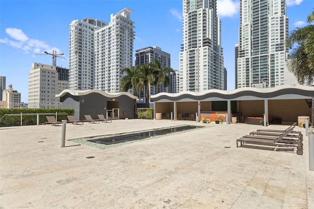 view of home's community featuring a city view and a patio