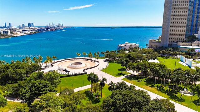 drone / aerial view featuring a water view and a city view