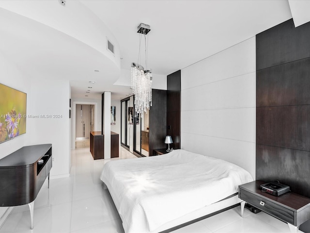 bedroom with light tile patterned floors