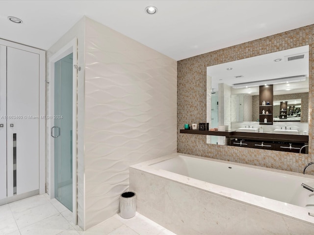 bathroom with vanity, shower with separate bathtub, and tile patterned flooring