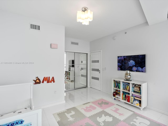 tiled bedroom featuring a closet