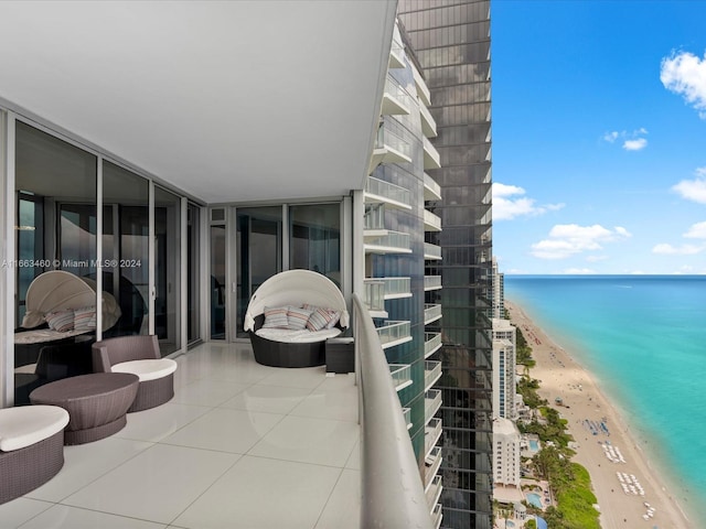 balcony with a beach view and a water view