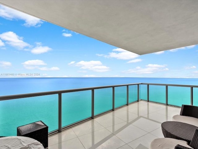 balcony featuring a water view