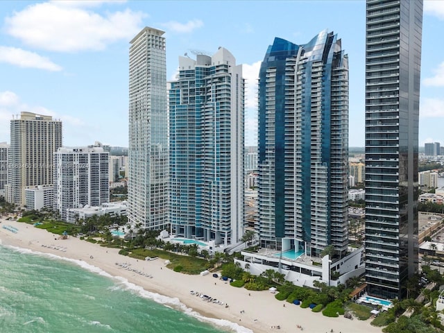 exterior space featuring a view of the beach and a water view