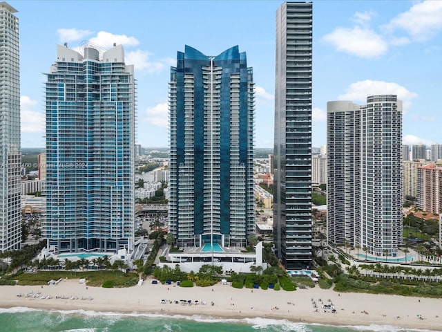 view of city featuring a water view and a beach view