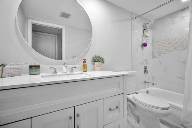 full bathroom with vanity, shower / bath combo, and toilet