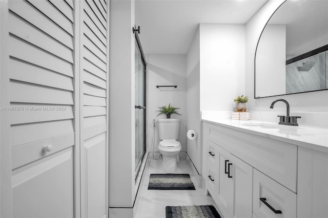 bathroom with vanity, an enclosed shower, and toilet