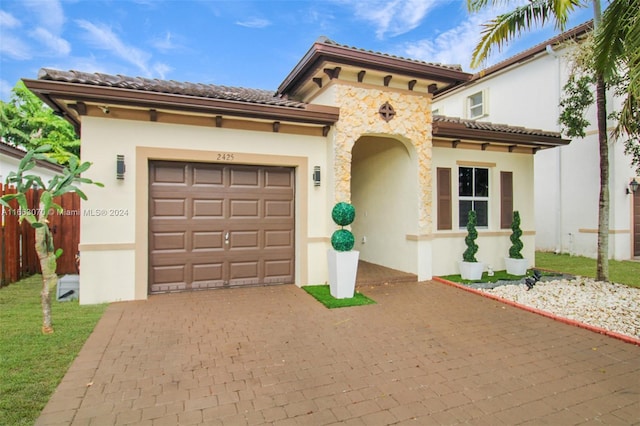 mediterranean / spanish-style house featuring a garage