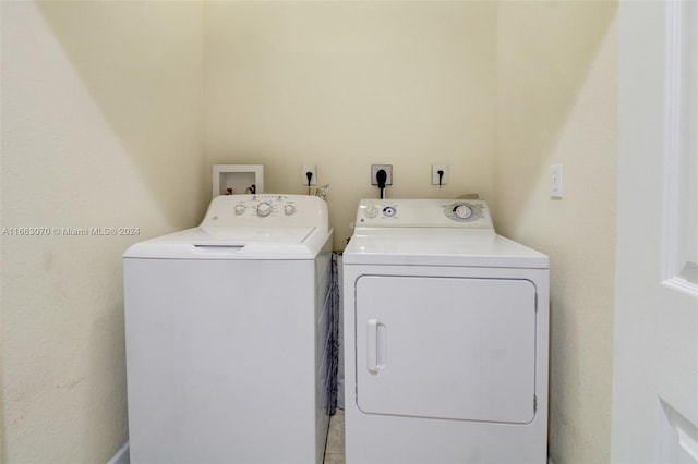 clothes washing area featuring washing machine and dryer