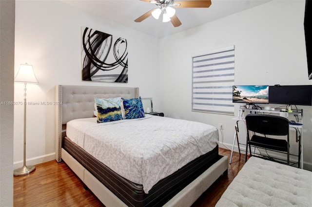 bedroom with ceiling fan and wood-type flooring