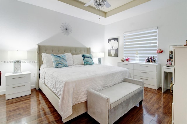 bedroom with ceiling fan and dark hardwood / wood-style flooring