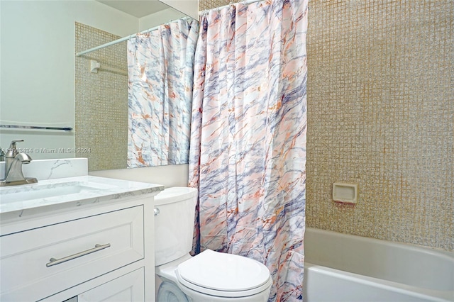 full bathroom with vanity, toilet, and shower / tub combo