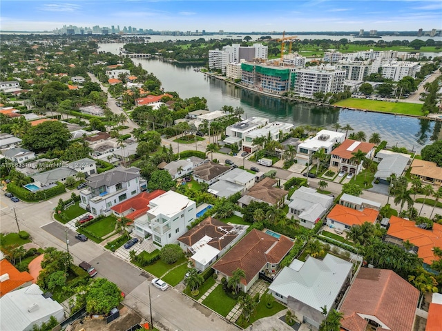 bird's eye view featuring a view of city and a water view