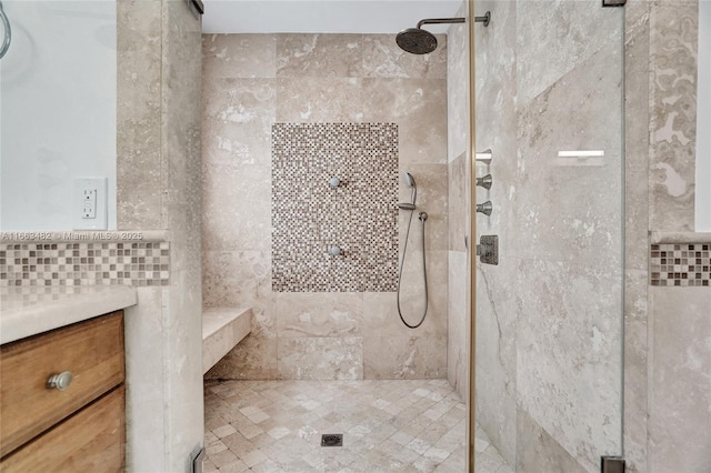 bathroom with a tile shower