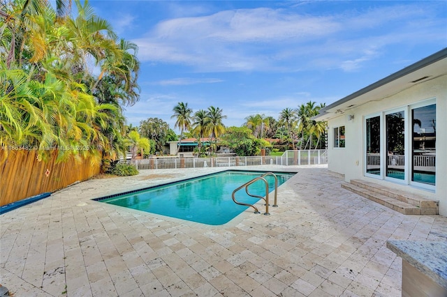 view of swimming pool featuring a patio