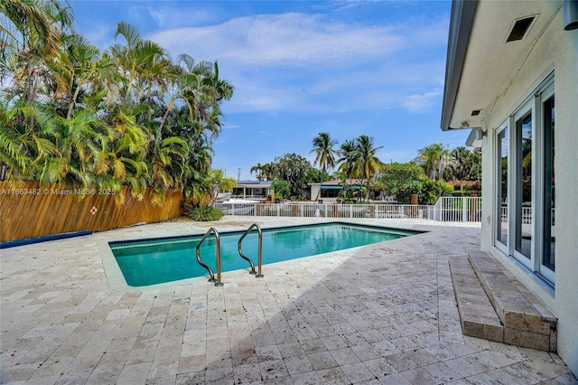 view of pool featuring a patio area