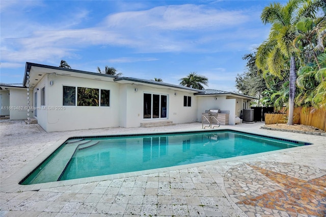 view of swimming pool featuring central AC and a patio area