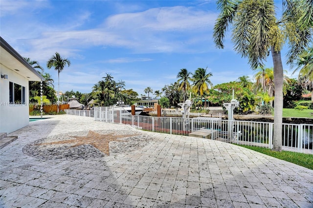 exterior space with a patio and a water view