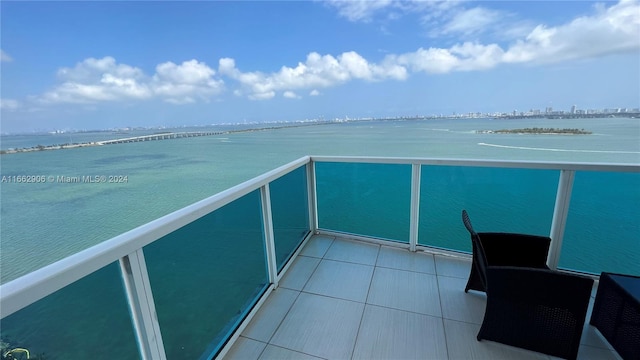 balcony featuring a water view