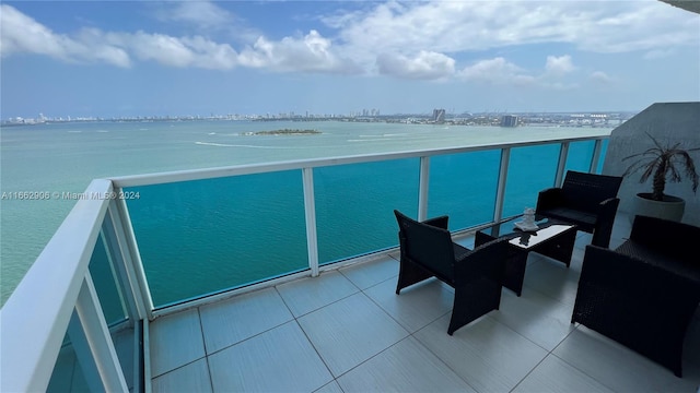 balcony featuring a water view