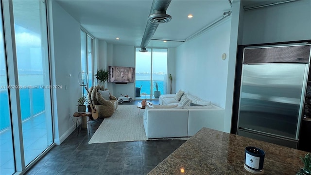 unfurnished living room featuring expansive windows