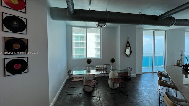 dining room featuring a water view