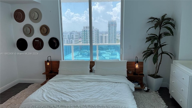 bedroom featuring dark hardwood / wood-style flooring