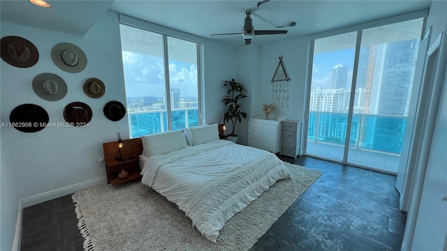 bedroom with ceiling fan and access to exterior