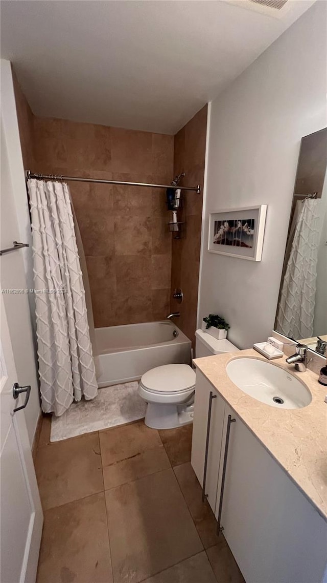 full bathroom featuring vanity, shower / tub combo, toilet, and tile patterned floors