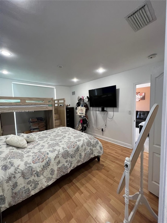 bedroom with wood-type flooring