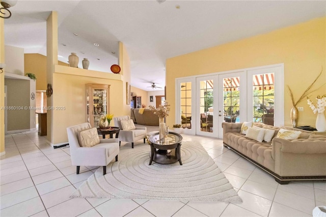 living room with lofted ceiling, light tile patterned floors, and french doors