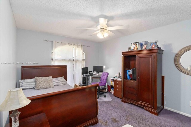 carpeted bedroom with ceiling fan and a textured ceiling