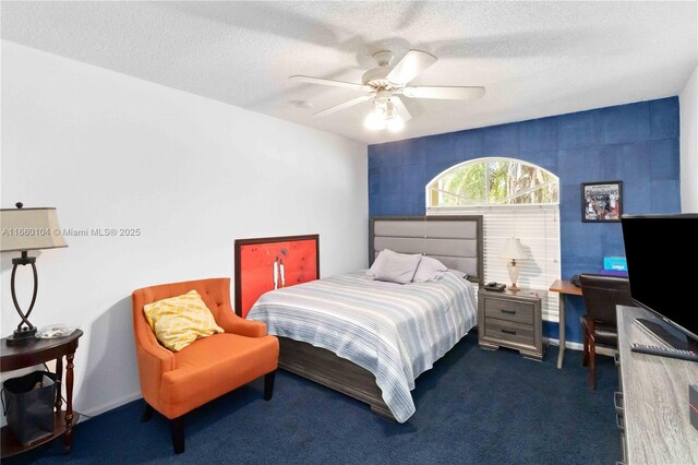 carpeted bedroom featuring a textured ceiling and ceiling fan