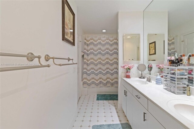 bathroom featuring a shower with curtain, vanity, and tile patterned floors