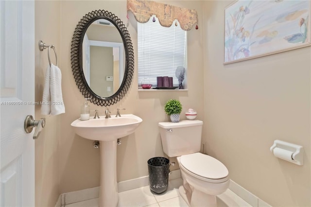 bathroom featuring tile patterned floors and toilet