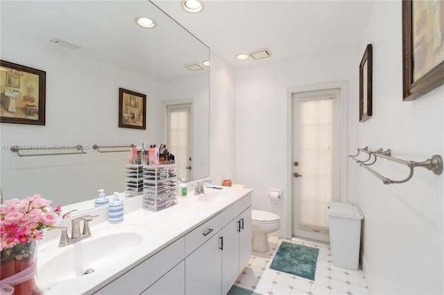 bathroom with vanity and toilet