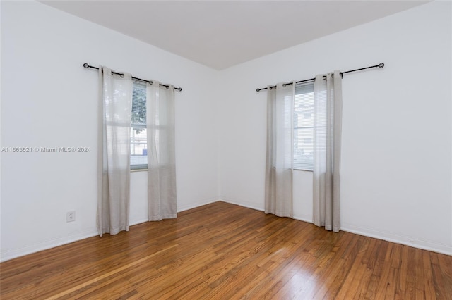 spare room featuring hardwood / wood-style floors