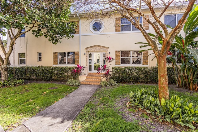 view of front of home with a front lawn