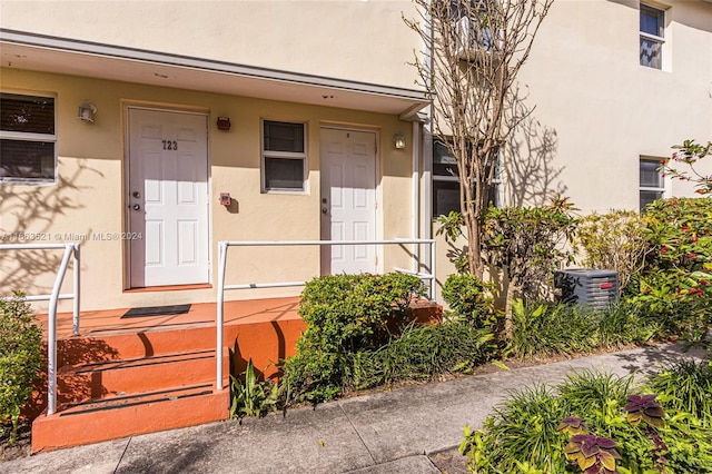 doorway to property featuring central AC