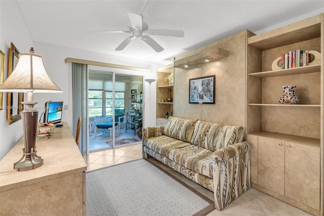 245 Grantham C 245, Deerfield Beach, FL 33442 - living area with light tile patterned floors, a textured ceiling, built in shelves, and ceiling fan
