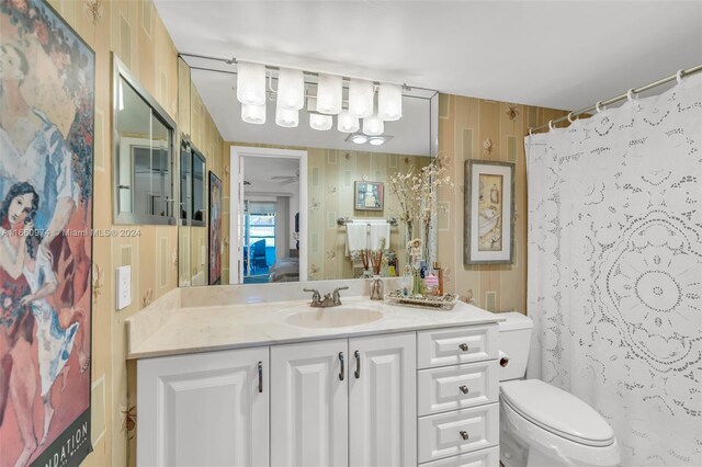 245 Grantham C 245, Deerfield Beach, FL 33442 - full bathroom featuring toilet, a chandelier, and vanity