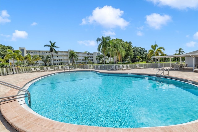 view of swimming pool with a patio