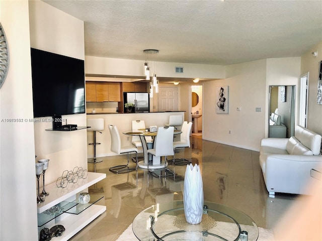 living room featuring a textured ceiling