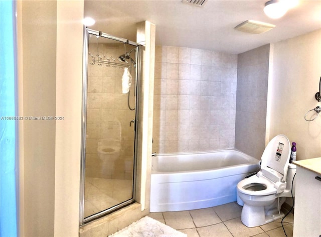 full bathroom featuring vanity, tile patterned flooring, separate shower and tub, and toilet