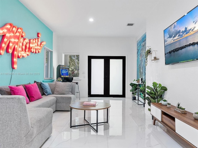 living room with marble finish floor, french doors, visible vents, and recessed lighting