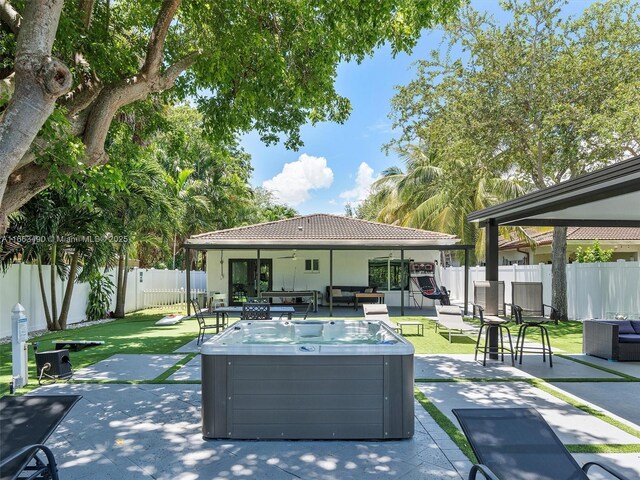 view of yard with outdoor lounge area, a patio area, and ceiling fan