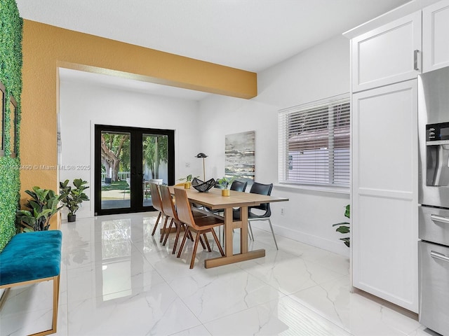 dining room with marble finish floor, french doors, and baseboards